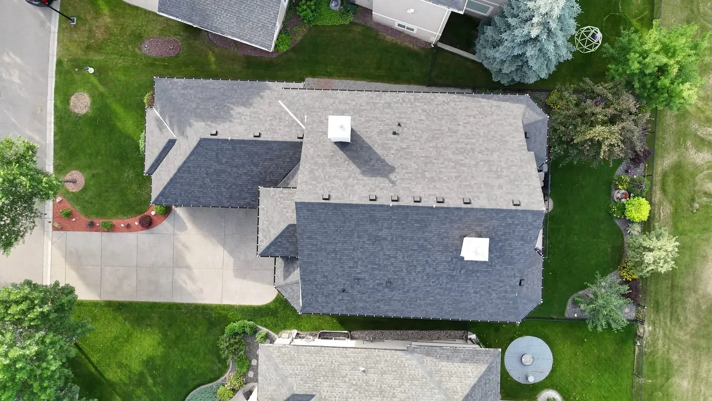 Aerial view of a completed asphalt shingle roof on a Calgary home
