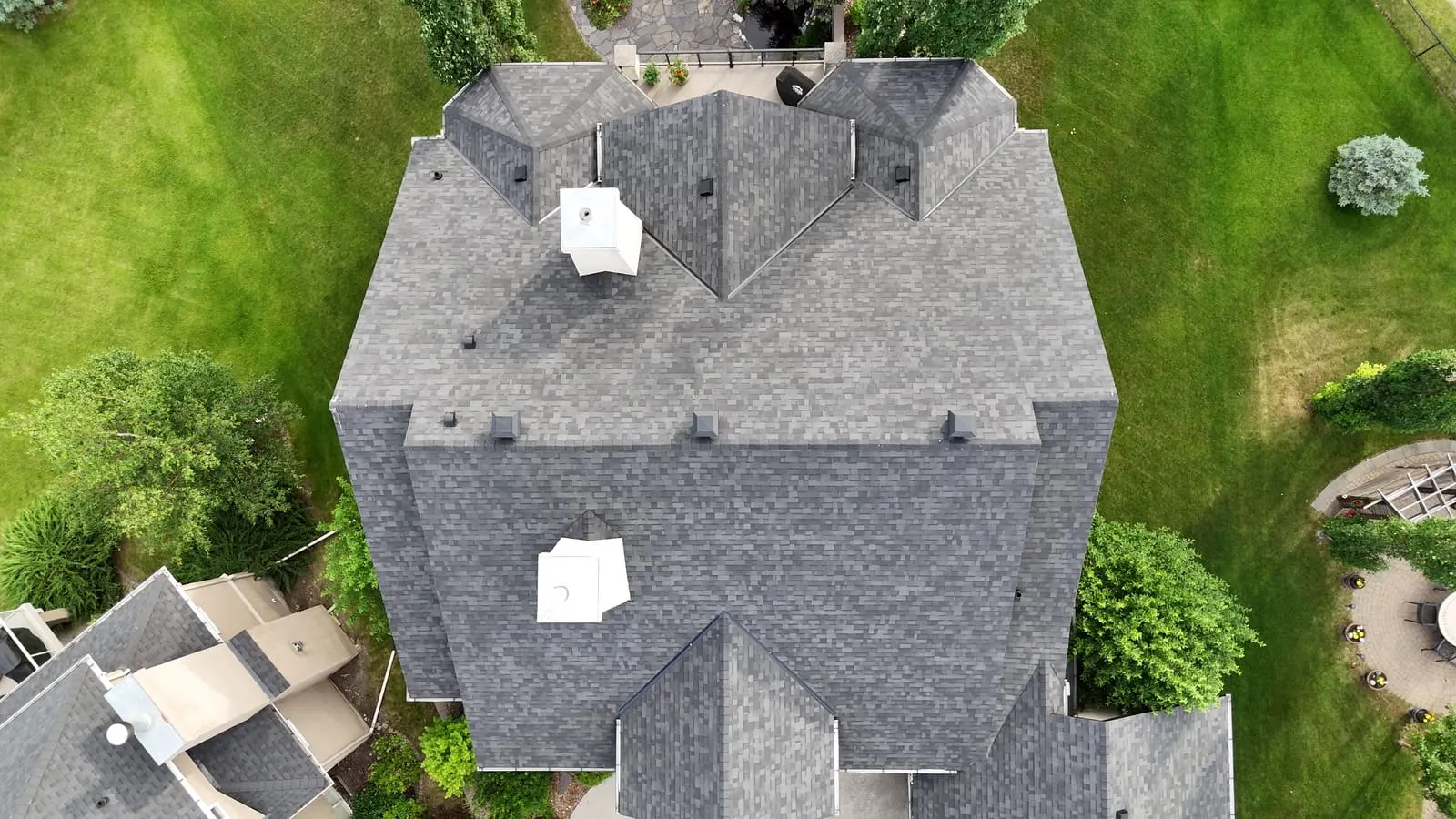 Overhead view of a finished asphalt shingle roof on a Calgary home